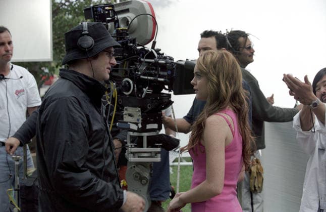 2004 - Mean Girls - Movie Set RELEASE DATE: April 30, 2004. MOVIE TITLE: Mean Girls. STUDIO: Paramount Pictures. PLOT: Raised in African bush country by her zoologist parents, Cady Heron thinks she knows about survival of the fittest. But the law of the jungle takes on a whole new meaning when the home-schooled 16-year-old enters public high school for the first time and encounters psychological warfare and unwritten social rules that teenage girls face today. PICTURED: Director MARK WATERS with LINDSAY LOHAN on the set. Toronto Ontario Canada Copyright: xParamountxPicturesx