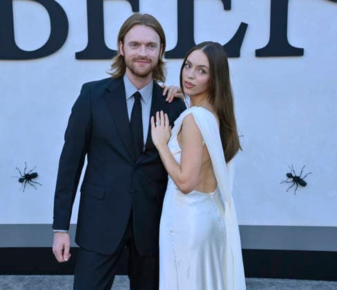 Songwriter Finneus (L) and his wife Claudia Sulewski attend Netflix s dark comedy TV series Beef at the Egyptian Theatre in the Hollywood section of Los Angeles on Wednesday, April 8, 2026. Storyline: Road rage ensues after a parking-lot incident, resulting in a bitter feud between the two antagonists. The vendetta between them and the lengths they ll go to in order to wreak revenge on each other spirals out of control, jeopardizing everything and everyone in their lives.  LAP2026040837 JIMxRUYMEN