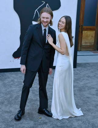 Songwriter Finneus (L) and his wife Claudia Sulewski attend Netflix s dark comedy TV series Beef at the Egyptian Theatre in the Hollywood section of Los Angeles on Wednesday, April 8, 2026. Storyline: Road rage ensues after a parking-lot incident, resulting in a bitter feud between the two antagonists. The vendetta between them and the lengths they ll go to in order to wreak revenge on each other spirals out of control, jeopardizing everything and everyone in their lives.  LAP2026040842 JIMxRUYMEN