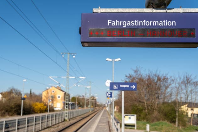 Germany - April 9, 2026: PHOTOMONTAGE, digital passenger information display at the train station showing Berlin Hanover. The image depicts an important rail route between two cities and represents rail connections, passenger traffic, and potential disruptions or delays along the route.
