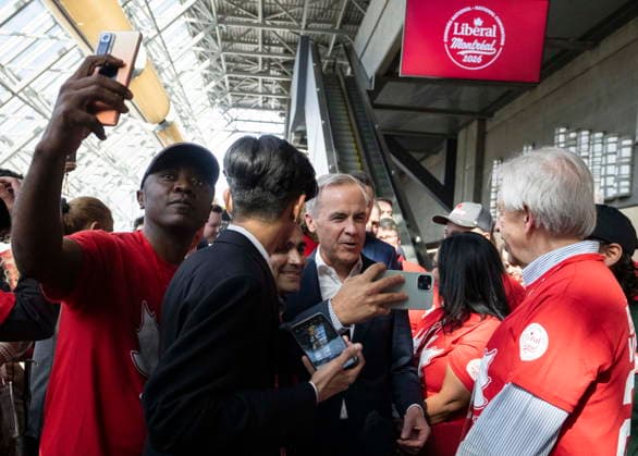 April 9, 2026, Montreal, Pq, CANADA: Prime Minister Mark Carney, centre, is greeted by supporters as he arrives at the Liberal Convention in Montreal on Thursday, April 9, 2026. Montreal CANADA  - ZUMAc35_ 20260409_zaf_c35_042 Copyright: xChristinnexMuschix