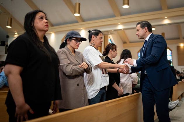 April 10, 2026, Bc, CANADA: Conservative leader Pierre Poilievre shakes hands with Father of victims Jhadell Sico and Rodel Sico, during Lapu-Lapu festival tragedy commemoration memorial mass at St. Andrew s Parish in Vancouver, on Friday April 10, 2026. CANADA  - ZUMAc35_ 20260410_zaf_c35_051 Copyright: xEthanxCairnsx