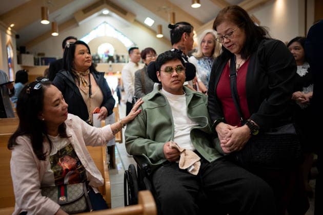 April 10, 2026, Bc, CANADA: Victim of the a Lapu-Lapu day festival tragedy, AJ, centre, is comforted by a family member of victim Jendhel Sico, alongside his mother Jhosie Sico, right, before a commemoration memorial mass at St. Andrew s Parish in Vancouver, on Friday April 10, 2026. CANADA - ZUMAc35_ 20260410_zaf_c35_057 Copyright: xEthanxCairnsx
