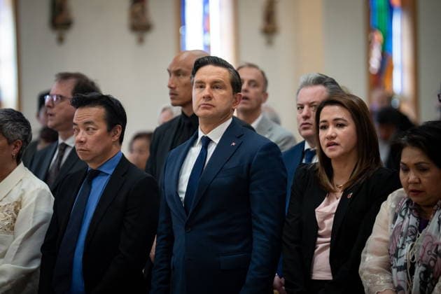 April 10, 2026, Bc, CANADA: Conservative leader Pierre Poilievre, centre, stands next to Vancouver Mayor Ken Sim, left, during a Lapu-Lapu Festival tragedy ceremonial mass at St. Andrew s Parish in Vancouver, on Friday April 10, 2026. CANADA  - ZUMAc35_ 20260410_zaf_c35_061 Copyright: xEthanxCairnsx