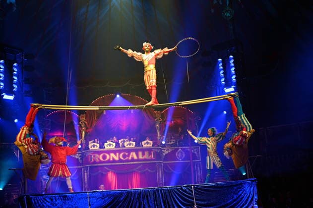 Trampoline artists Venice Carnival and clown Prof Wacko Valdimir Georgiev performing in the ring at the Cologne premiere of Circus Roncalli