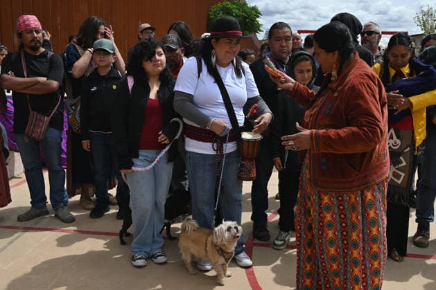 April 12, 2026, Tecate, Baja California, Mexico: Norma Alicia Mesa Calles, a member of native communities, mainly Kumeyaay native group, blessed people during a â€oeceremony†rally against the destruction of the Kuchamaa Mountain left by the construction of a new border wall at the US-Mexico Border in Tecate, Baja California, Mexico on Sunday, April 12, 2026. The Kuchamaa Mountain is considered a sacred site by native groups living in both sides of the border. Tecate Mexico - ZUMAm180 20260412_zip_m180_002 Copyright: xCarlosxA.xMorenox