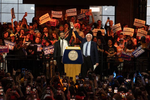 April 12, 2026, New York, New York, USA: Senator Bernie Sanders and NYC Mayor Zohran Mamdani raise clasped hands in victory at the 100 Days (in office) Address. New York USA - ZUMAe87_ 20260412_znp_e87_006 Copyright: xDanielxEframx