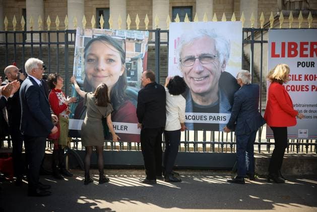REMOVAL OF PORTRAITS OF CECILE KOHLER AND JACQUES PARIS ASSEMBLEE NATIONALE Thomas Padilla MAXPPP Paris FRANCE 14 04 2026 CEREMONY FOR THE REMOVAL OF THE TWO FORMER HOSTAGES IN IRAN, CECILE KOHLER AND JACQUES PARIS ON THE GATES OF THE NATIONAL ASSEMBLY IN PRESENCE OF THE PRESIDENT OF THE NATIONAL ASSEMBLY, YAEL BRAUN PIVET Ceremony for the removal of the two former hostages in Iran, Cecile Kohler and Jacques Paris on the gates of the National Assembly in Paris on April 14, 2026 Paris FRANCE  Copyright: xMAXPPPxThomasxPadillax TPA260414002 TPA260414002