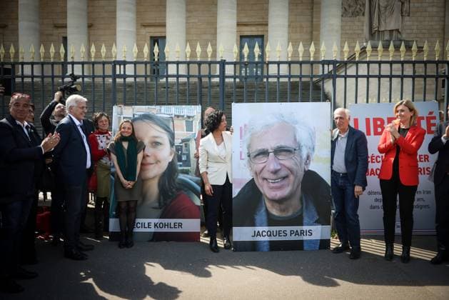REMOVAL OF PORTRAITS OF CECILE KOHLER AND JACQUES PARIS ASSEMBLEE NATIONALE Thomas Padilla MAXPPP Paris FRANCE 14 04 2026 CEREMONY FOR THE REMOVAL OF THE TWO FORMER HOSTAGES IN IRAN, CECILE KOHLER AND JACQUES PARIS ON THE GATES OF THE NATIONAL ASSEMBLY IN PRESENCE OF THE PRESIDENT OF THE NATIONAL ASSEMBLY, YAEL BRAUN PIVET Ceremony for the removal of the two former hostages in Iran, Cecile Kohler and Jacques Paris on the gates of the National Assembly in Paris on April 14, 2026 Paris FRANCE  Copyright: xMAXPPPxThomasxPadillax TPA260414007 TPA260414007