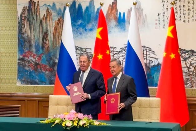 CHINA, BEIJING - APRIL 14, 2026: Russia s Foreign Minister Sergei Lavrov (L) and China s Foreign Minister Wang Yi sign a plan for consultations between the ministries for 2026. Video grab. Best quality available. Alexander Burmistrov TASS  91258354