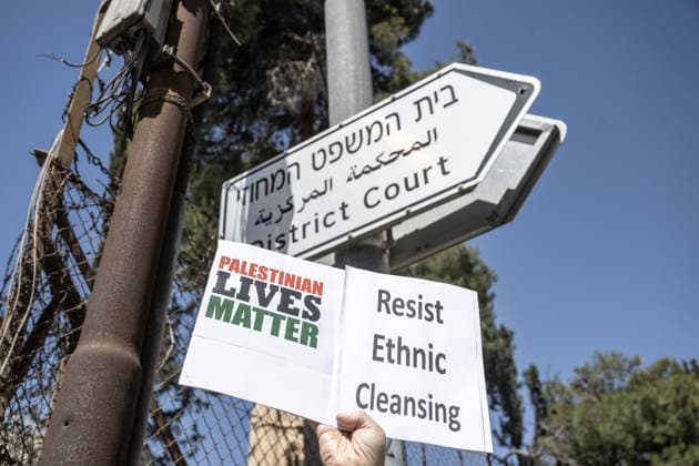Protest against demolition orders in Al-Bustan neighborhood of Silwan, East Jerusalem JERUSALEM - APRIL 14: Activists holding banners gather outside a court building in East Jerusalem to protest against the demolition orders targeting Palestinian homes in the Al-Bustan neighborhood of Silwan district, East Jerusalem on April 14, 2026. As legal proceedings continue inside regarding the displacement of Palestinian residents, demonstrators held signs and chanted slogans calling for an immediate halt to the forced evictions and the protection of Palestinian presence in the area. Mostafa Alkharouf Anadolu Jerusalem Israel. Editorial use only. Please get in touch for any other usage.  Copyright: x2026xAnadoluxMostafaxAlkharoufx