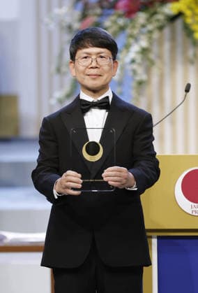 Japan Prize award ceremony Zhijian James Chen, professor of molecular biology at the University of Texas, poses for a photo during an award ceremony in Tokyo on April 14, 2026, after winning the Japan Prize for discovery of the nucleic acid sensing mechanism by the innate immune system. The Japan Prize is awarded annually to scientists and engineers from around the world who have made significant contributions to the advancement of science and technology.  A14AA0005459767P