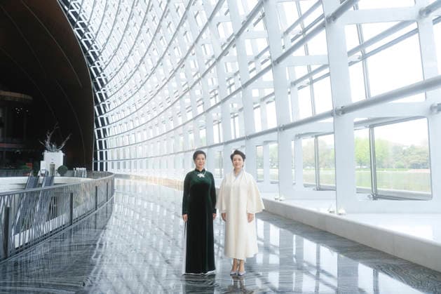 (260415) -- BEIJING, April 15, 2026 -- Peng Liyuan, wife of General Secretary of the Communist Party of China Central Committee and Chinese President Xi Jinping, and Ngo Phuong Ly, wife of General Secretary of the Communist Party of Vietnam Central Committee and Vietnamese President To Lam, visit China s National Center for the Performing Arts (NCPA) in Beijing, capital of China, April 15, 2026. Ngo Phuong Ly is accompanying To Lam on his state visit to China. ) CHINA-BEIJING-PENG LIYUAN-VIETNAM-NGO PHUONG LY-NCPA-VISIT (CN) DingxLin 