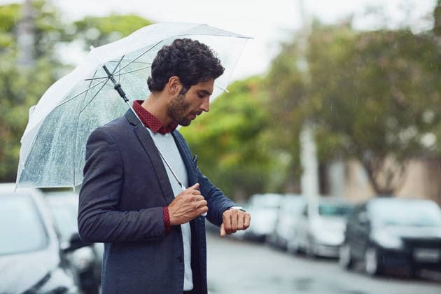 Cropped shot of a handsome young businessman on his morning commute in the rain. (License=RF) ,model released, Symbolfoto  Copyright: xZoonar.com YurixArcursxpeopleimages.comx 18389078 ,model released, Symbolfoto ,property released