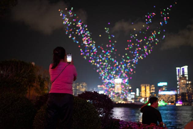 HONGKONG-NSL People watching a drone show over Victoria Harbor during a drone show to make the national security education day in Hong Kong, April 15, 2026. NEXPHER Vernon Yuen HONG KONG