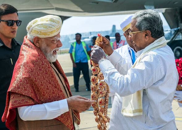 RECORD DATE NOT STATED PM Modi receives a warm welcome from Karnataka Chief Minister Siddaramaiah at Airport, in Bengaluru Bengaluru, Apr 15 (ANI): Prime Minister Narendra Modi receives a warm welcome from Karnataka Chief Minister Siddaramaiah on his arrival at Airport, in Bengaluru on Wednesday. (DPR PMO ANI Photo) Bengaluru Karnataka India Copyright: xANIx ANI_20260415087