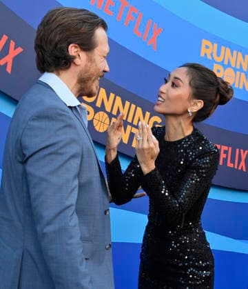 Cast members Scott MacArthur (L) and Brenda Song attend the premiere of Netflix s Season 2 TV series sport comedy Running Point at the Egyptian Theatre in the Hollywood section of Los Angeles on Wednesday, April 15, 2026. Storyline: Isla Gordon, overlooked her whole life, is appointed President of the LA Waves basketball team, a family business, when her brother enters rehab. She aims to prove she is the right choice despite skepticism.  LAP2026041534 JIMxRUYMEN