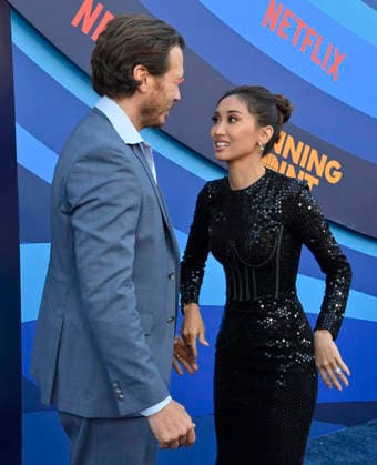 Cast members Scott MacArthur (L) and Brenda Song attend the premiere of Netflix s Season 2 TV series sport comedy Running Point at the Egyptian Theatre in the Hollywood section of Los Angeles on Wednesday, April 15, 2026. Storyline: Isla Gordon, overlooked her whole life, is appointed President of the LA Waves basketball team, a family business, when her brother enters rehab. She aims to prove she is the right choice despite skepticism.  LAP2026041531 JIMxRUYMEN