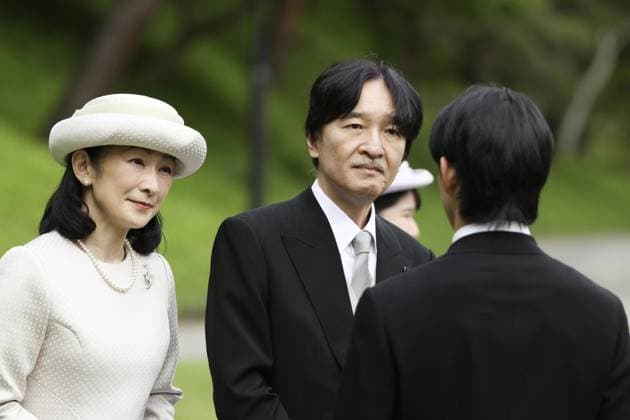 Japanese imperial garden party Japanese Crown Prince Fumihito (facing camera) and Crown Princess Kiko chat with an invitee during a spring imperial garden party at the Akasaka Imperial Gardens in Tokyo on April 17, 2026.  A14AA0005466174P