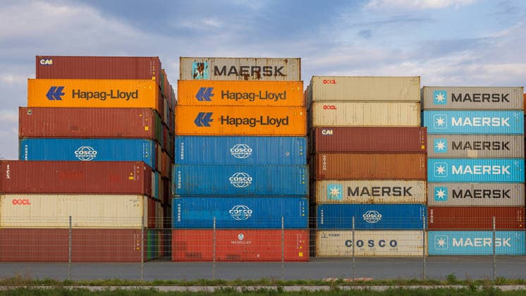 Logistics industry under pressure Supply chains in the face of global crises, Nuremberg, 18 04 2026 Three tall stacks of containers from various world market leaders in container shipping in the Port of Nuremberg Maersk, Hapag Lloyd, COSCO Shipping, OOCL, CAI, Triton and Magellan The picture combines the most important players in global sea freight tran 20260418-286A4280-M4000