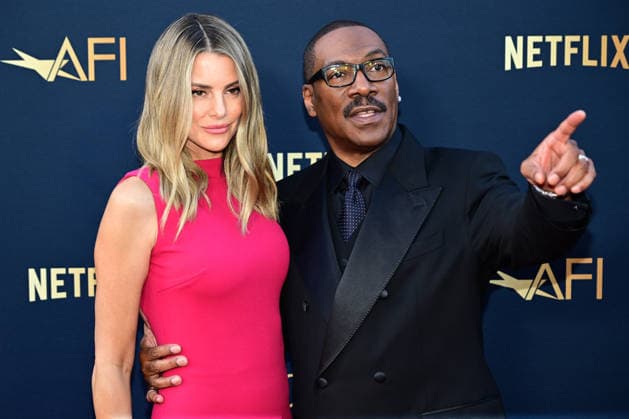 Eddie Murphy and wife Paige Butcher attend the 51st American Film Institute (AFI) Life Achievement Award ceremony at The Dolby Theatre in the Hollywood section of Los Angeles on Saturday, April 18, 2026. Hollywood legends gathered Saturday at the gala tribute to Eddie Murphy in celebration of his five-decade career.  LAP2026041845 JOHNxMCCOY