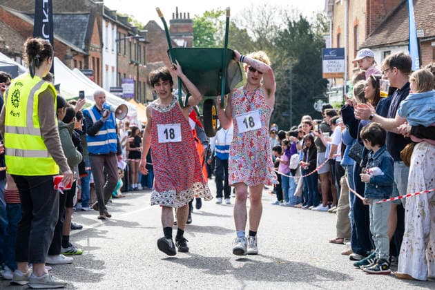 April 19, 2026, London, London, UK: LONDON, UK. Team 18 brings up the rear as costumed participants take part Ã¢â‚¬oeYe Olde Wheelbarrow RaceÃ¢â‚¬Â in Pinner, north-west London during the townÃ¢â‚¬â ¢s St GeorgeÃ¢â‚¬â ¢s Day celebrations raising funds for charity. The race involves pushing a teammate in a wheelbarrow with multiple beer stops en-route. London UK  - ZUMAl94_ 20260419_zaf_l94_036 Copyright: xStephenxChungx