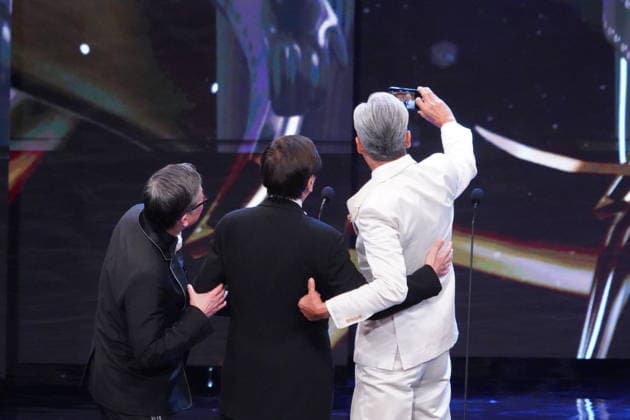 HONG KONG, CHINA - APRIL 19: Director Andrew Lau Wai-Keung, actor Chow Yun-fat and film producer and executive John Chu Ka-yan pose for a selfie on the stage at the 44th Hong Kong Film Awards on April 19, 2026 in Hong Kong, China.  Copyright: xVCGx 111635887811