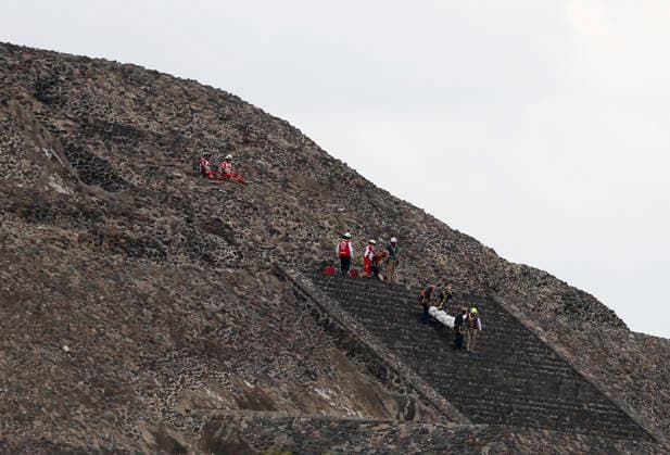 (260421) -- STATE OF MEXICO, April 21, 2026 -- Rescuers work at the site of a shooting at the Teotihuacan archaeological site in the State of Mexico, Mexico, April 20, 2026. A shooting at the Teotihuacan archaeological site in central Mexico has left two people dead, including the attacker, and six others injured, authorities said Monday. (Str Xinhua) MEXICO-STATE OF MEXICO-TEOTIHUACAN ARCHAEOLOGICAL SITE-SHOOTING Stringer 