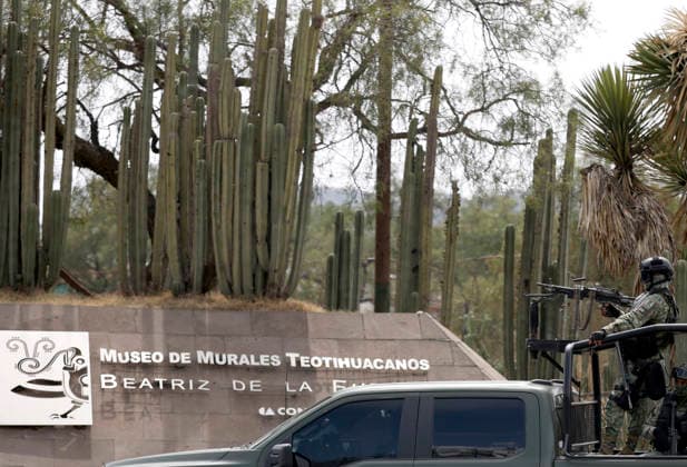 (260421) -- STATE OF MEXICO, April 21, 2026 -- A law enforcement personnel stands guard at the site of a shooting at the Teotihuacan archaeological site in the State of Mexico, Mexico, April 20, 2026. A shooting at the Teotihuacan archaeological site in central Mexico has left two people dead, including the attacker, and six others injured, authorities said Monday. (Str Xinhua) MEXICO-STATE OF MEXICO-TEOTIHUACAN ARCHAEOLOGICAL SITE-SHOOTING Stringer 