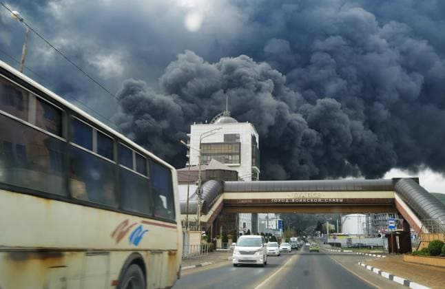 Russia Oil Refinery Fire 9148864 21.04.2026 Smoke rises from a fire at the Tuapse Oil Terminal in Tuapse, Krasnodar Territory, Russia. According to Russian officials, a massive drone attack on the night of April 20 targeted the city of Tuapse on the shores of the Black Sea, damaging transport infrastructure at the port and setting oil product storage tanks on fire. One person was killed and another injured. More than 200 rescuers were called in to extinguish the blaze. Boris Morozov Sputnik Tuapse Krasnodar region Russia  Copyright: xBorisxMorozovx