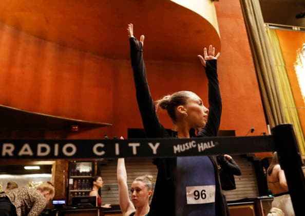 Dancers warm up in the Grand Foyer at Radio City Music Hall before auditioning at the Rockettes open call auditions at Radio City Music Hall in New York City on Wednesday, April 22, 2026. Dancers attending the audition will be considered for a spot on the Rockettes line in the 2026 Christmas Spectacular Starring the Radio City Rockettes and for an invitation to participate in the company s no-fee dancer development.programming this summer which serves as the Rockettes main talent pipeline.  NYP20260422118 JohnxAngelillo