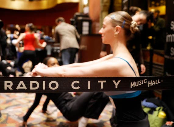 Dancers warm up in the Grand Foyer at Radio City Music Hall before auditioning at the Rockettes open call auditions at Radio City Music Hall in New York City on Wednesday, April 22, 2026. Dancers attending the audition will be considered for a spot on the Rockettes line in the 2026 Christmas Spectacular Starring the Radio City Rockettes and for an invitation to participate in the company s no-fee dancer development.programming this summer which serves as the Rockettes main talent pipeline.  NYP20260422121 JohnxAngelillo