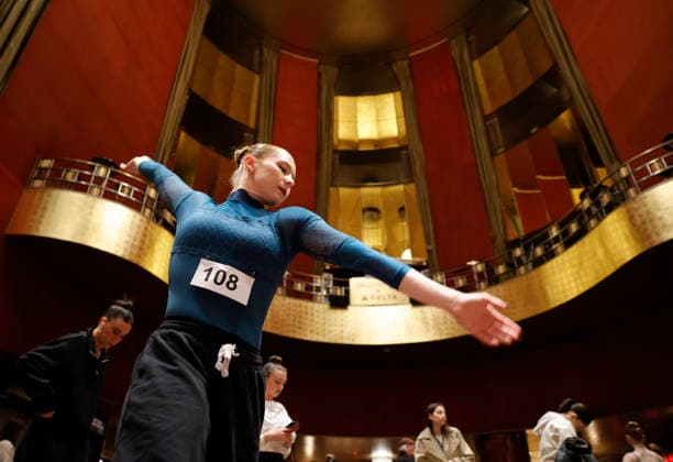 Dancers warm up in the Grand Foyer at Radio City Music Hall before auditioning at the Rockettes open call auditions at Radio City Music Hall in New York City on Wednesday, April 22, 2026. Dancers attending the audition will be considered for a spot on the Rockettes line in the 2026 Christmas Spectacular Starring the Radio City Rockettes and for an invitation to participate in the company s no-fee dancer development.programming this summer which serves as the Rockettes main talent pipeline.  NYP20260422123 JohnxAngelillo