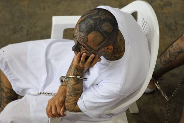 Gang Members Face Massive Court Hearing at CECOT in El Salvador SAN VICENTE, EL SALVADOR - APRIL 23: A gang member listening to a virtual hearing during a massive court hearing for gang members of the Mara Salvatrucha (MS-13), held at the Terrorism Confinement Center (CECOT), in the municipality of Tecoluca, in San Vicente, El Salvador on April 23, 2026. According to an announcement by the Attorney General s Office (FGR) of El Salvador, a mega-trial against 486 gang members of the Mara Salvatrucha (MS-13), including leaders and founders of said criminal organization, began on Monday, April 21. Alex Pena Anadolu San Vicente El Salvador. Editorial use only. Please get in touch for any other usage.  Copyright: x2026xAnadoluxAlexxPenax