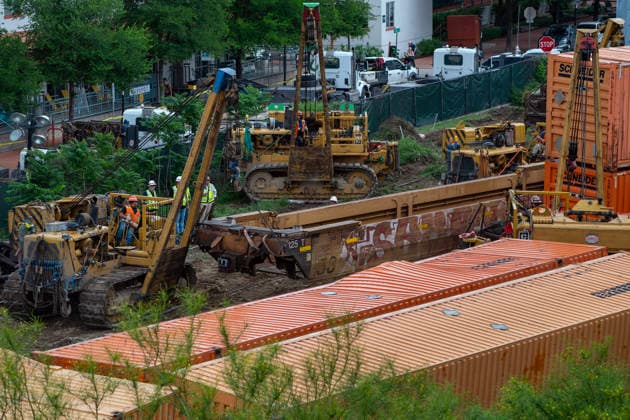 April 23, 2026, Austin, Texas, United States: A 230-car freight train derailment destoyed a section of railroad track and pitched several container cars alongside the line on Thursday, April 23, 2026 in downtown Austin, Texas. Police were dispatched at about 4:45am and crews started working to clear and repair the section of track almost immediately following. No hazardous chemicals were being transported and no injuries are reported. Austin United States  - ZUMAs312 20260423_znp_s312_005 Copyright: xDustinxSafranekx