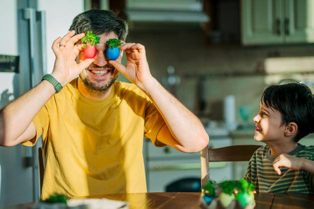 Father and son playing with Easter egg microgreens in kitchen model released, Symbolfoto property released, ANAF05726