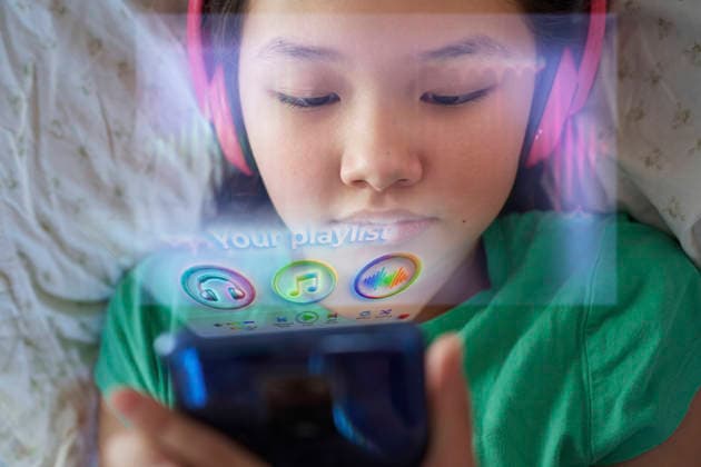 User listening to music via holographic app model released, Symbolfoto property released, AZF01257