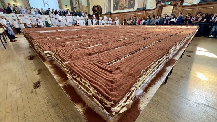 World s longest tiramisu record broken in London LONDON, UNITED KINGDOM - APRIL 26: A record-breaking tiramisu, measuring 440.58 meters, is displayed at Chelsea Old Town Hall in London, United Kingdom on April 26, 2026. Led by Italian entrepreneur Mirko Ricci and the London branch of the Federation of Italian Chefs, dozens of volunteers collaborated over two days to surpass the previous 273.5-meter record set in Milan in 2019. Guinness World Records official adjudicator Lorenzo Veltri verified the measurement on-site during the event, which was supported by the Italian Embassy and the Italian Cultural Institute. All proceeds from the organization were donated to the Esharelife Foundation to support efforts in combating poverty. Muhammed Yay  Copyright: x2026xAnadoluxMuhammedxYaylalix
