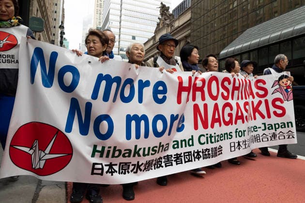 April 26, 2026, New York, New York, USA: Japanese and Korean survivors of the atomic bombings of Hiroshima and Nagasaki in August 1945 lead hundreds of anti-war advocates marching through the streets of midtown Manhattan to the United Nations after a rally against nuclear weapons at the New York Public Library (NYPL) on Fifth Avenue. Marchers hold a banner that reads No more HIROSHIMAS No more NAGASAKIS Hibakusha and Citizens for Peace-Japan. Demonstrators call on the United Nations and the delegates to the Nuclear Nonproliferation Treaty Review Conference, being held April 27 - May 22, to work toward a nuclear weapons-free world, abolish nuclear tests, phase out nuclear energy, provide reparations for indigenous peoples harmed by nuclear  - ZUMAr174 20260426_znp_r174_041 Copyright: xGinaxMxRandazzox