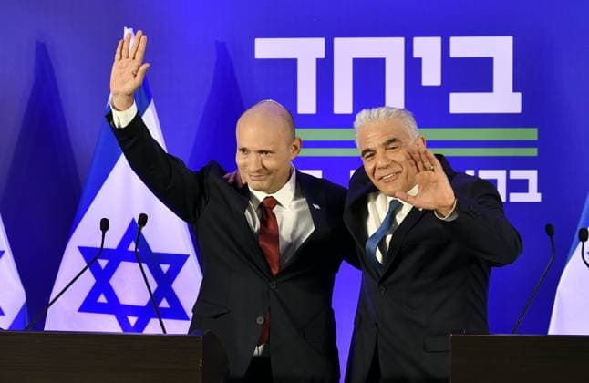 (260427) -- HERZLIYA, April 27, 2026 -- Israeli opposition leader Yair Lapid (R) and former Prime Minister Naftali Bennett attend a press conference in Herzliya, Israel, April 26, 2026. Israeli opposition leader Yair Lapid and former Prime Minister Naftali Bennett said on Sunday that they will run together in this year s elections, aiming to unseat incumbent Prime Minister Benjamin Netanyahu. (JINI via Xinhua) ISRAEL-HERZLIYA-FORMER PMS-ELECTIONS-PRESS CONFERENCE JixNitupianshe 