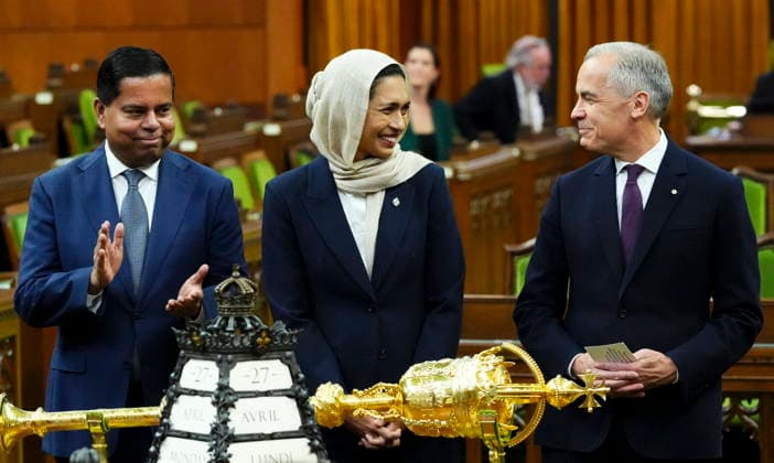 April 27, 2026, Ottawa, On, CAN: Prime Minister Mark Carney, right, and Minister of Public Safety Gary Anandasangaree, left, introduce new member of Parliament Doly Begumon to the House of Commons on Parliament Hill in Ottawa on Monday, April 27, 2026. Ottawa CAN - ZUMAc35_ 20260427_zaf_c35_035 Copyright: xSeanxKilpatrickx