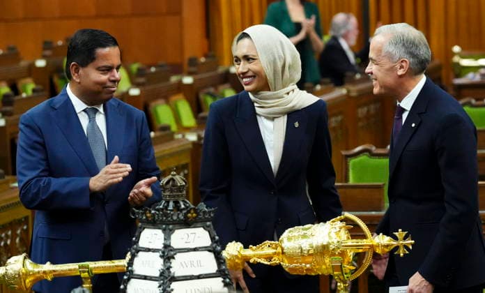 April 27, 2026, Ottawa, On, CAN: Prime Minister Mark Carney, right, and Minister of Public Safety Gary Anandasangaree, left, introduce new member of Parliament Doly Begumon to the House of Commons on Parliament Hill in Ottawa on Monday, April 27, 2026. Ottawa CAN - ZUMAc35_ 20260427_zaf_c35_037 Copyright: xSeanxKilpatrickx