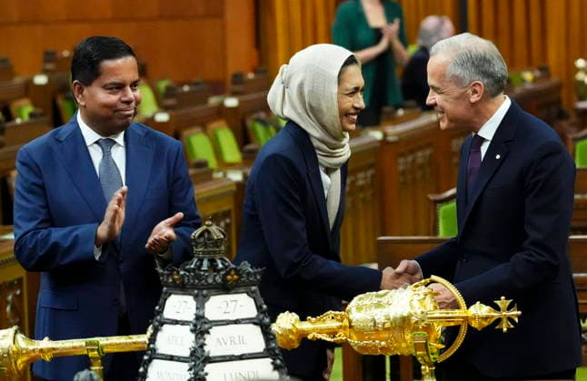 April 27, 2026, Ottawa, On, CAN: Prime Minister Mark Carney, right, and Minister of Public Safety Gary Anandasangaree, left, introduce new member of Parliament Doly Begumon to the House of Commons on Parliament Hill in Ottawa on Monday, April 27, 2026. Ottawa CAN - ZUMAc35_ 20260427_zaf_c35_036 Copyright: xSeanxKilpatrickx