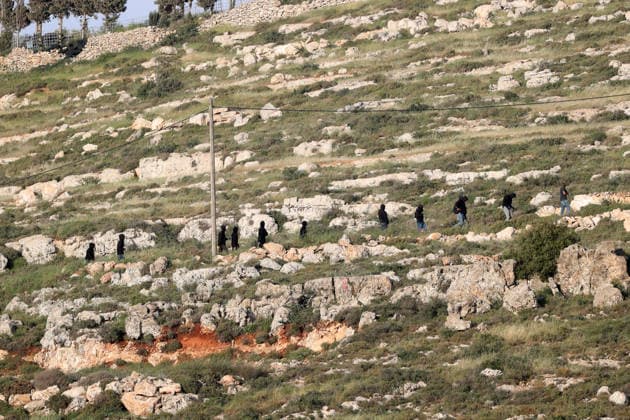 Palestinians evacuate home after Israeli Settler attack in West Bank WEST BANK, PALESTINE - APRIL 27: Israeli settlers are seen in the village of Jalud, south of Nablus, West Bank, Palestine on April 27, 2026. A group of settlers, under the protection of Israeli soldiers, attacked Palestinians and their homes with stones and Molotov cocktails, leading to property damage and the evacuation of usable items from affected houses. Issam Rimawi Anadolu Nablus West Bank. Editorial use only. Please get in touch for any other usage.  Copyright: x2026xAnadoluxIssamxRimawix