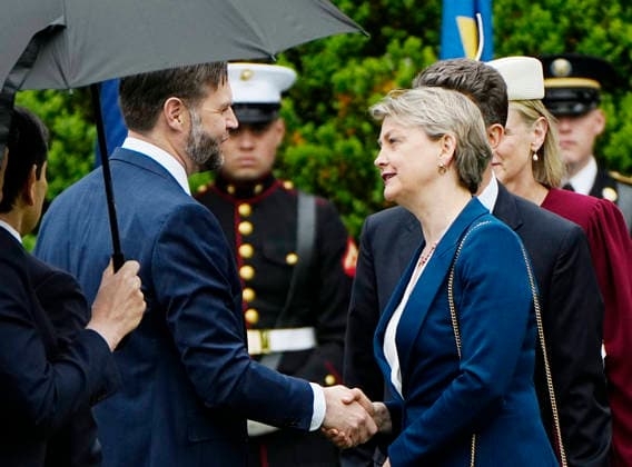 UK Foreign Secretary Yvette Cooper shakes hands with Vice President JD Vance before Britain s King Charles III and Queen Camilla at an official welcoming ceremony at the White House in Washington DC on Tuesday, April 28, 2026. The king is on a four-day state visit to the U.S. and will stop in New York and Washington, where he will meet with U.S. officials and deliver an address to Congress.  WAP20260428903 BONNIExCASH
