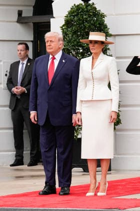 President Donald Trump and First Lady Melania Trump arrive to greet Britain s King Charles III and Queen Camilla at an official welcoming ceremony at the White House in Washington DC on Tuesday, April 28, 2026. The king is on a four-day state visit to the U.S. and will stop in New York and Washington, where he will meet with U.S. officials and deliver an address to Congress.  WAX20260428810 YURIxGRIPAS