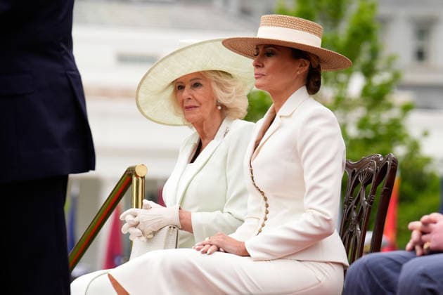 Queen Camila and First lady Melania Trump sit on the podium during an official welcoming ceremony for Britain s King Charles III at the White House in Washington DC on Tuesday, April 28, 2026. The king is on a four-day state visit to the U.S. and will stop in New York and Washington, where he will meet with U.S. officials and deliver an address to Congress.  WAX20260428850 YURIxGRIPAS