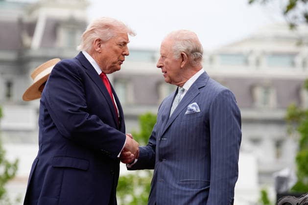 President Donald Trump shakes hands with Britain s King Charles III on the podium during an official welcoming ceremony at the White House in Washington DC on Tuesday, April 28, 2026. The king is on a four-day state visit to the U.S. and will stop in New York and Washington, where he will meet with U.S. officials and deliver an address to Congress.  WAX20260428841 YURIxGRIPAS