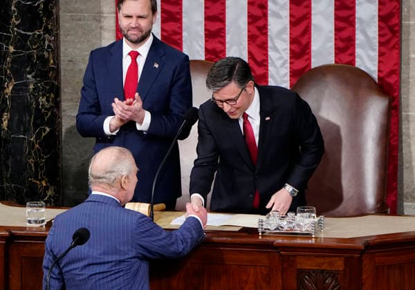Britain s King Charles III shakes hands with Speaker of the House Mike Johnson and Vice President JD Vance as he prepares to deliver an address to a joint meeting of Congress at the U.S. Capitol in Washington DC on Tuesday, April 28, 2026. The king and Queen Camilla are on a four-day state visit to the U.S. with stops in Washington and New York.  WAP20260428961 BONNIExCASH