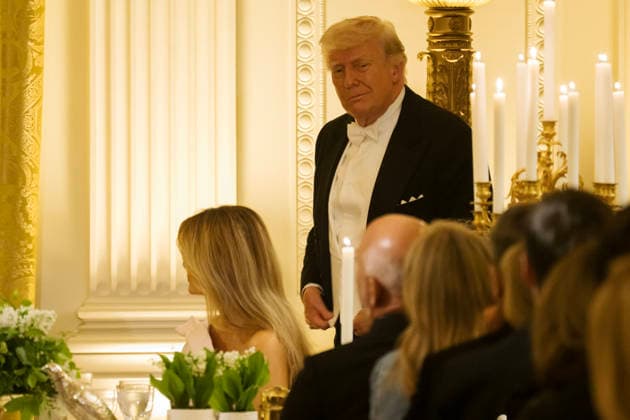 President Donald Trump looks towards a table as guests such as Amazon Founder Jeff Bezos listen to Great Britain s King Charles giving remarks during a state dinner at the White House on Tuesday, April 28, 2026 in Washington, D.C. Charles spoke to a joint session of Congress earlier in the day, and attended several events with U.S. President Donald Trump.  WAX20260428229 CraigxHudson